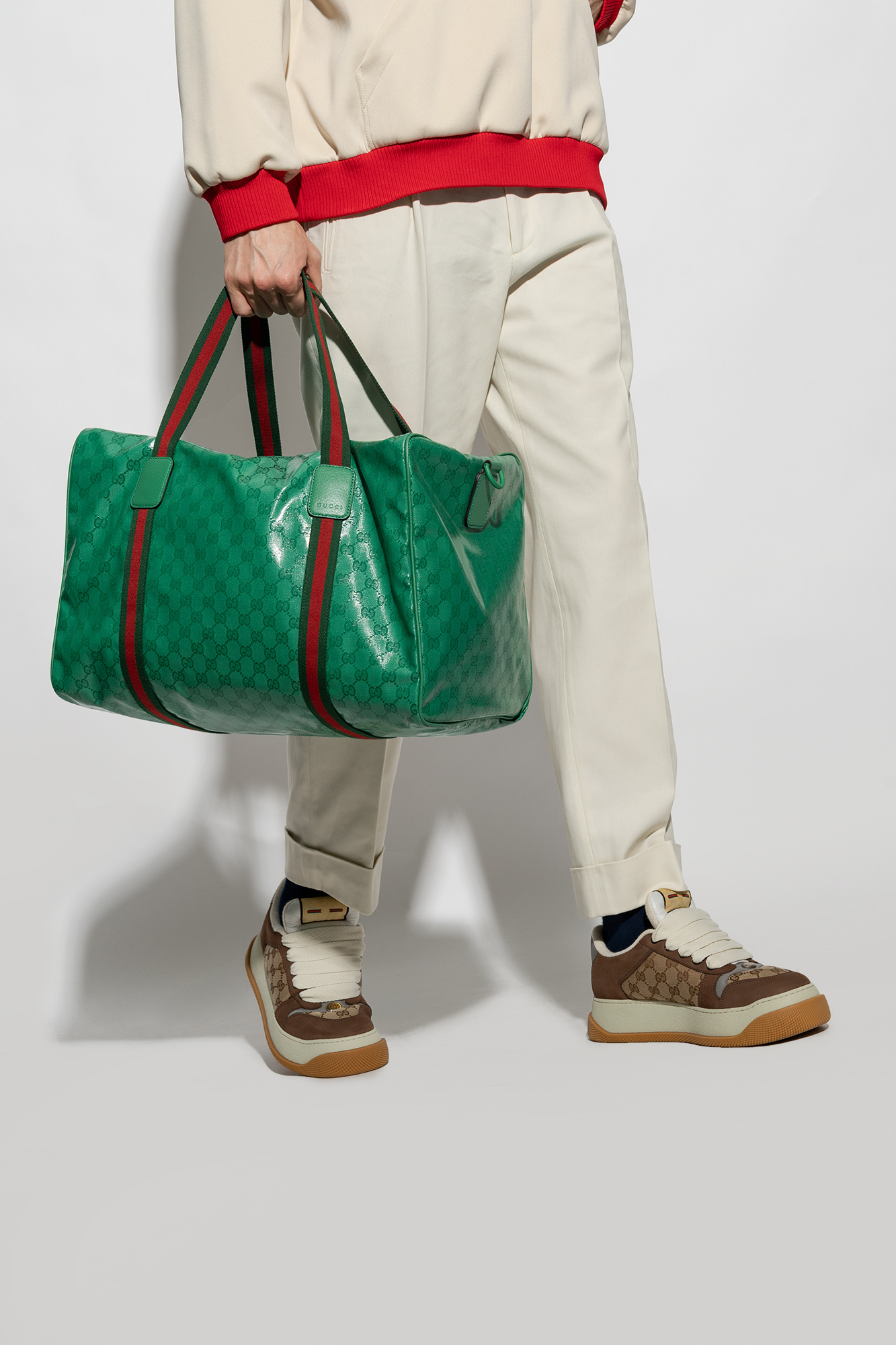 Green Holdall bag with embossed logo gucci SS19 gucci SS19 perforated Oxford shoes IetpShops Oman